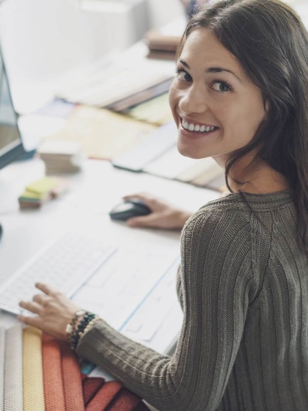 smiling-interior-designer-working-at-desk-1.jpg smiling-interior-designer-working-at-desk-1.jpg